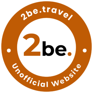 2be.travel unofficial website logo. Orange circle with "2be.travel" and "Unofficial Website" text.